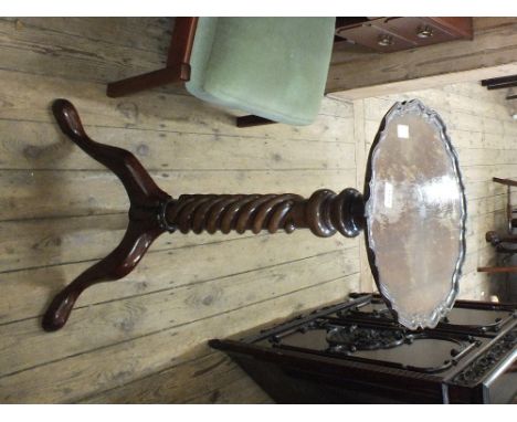 A mahogany tray top torchiere barley twist column on tripod base