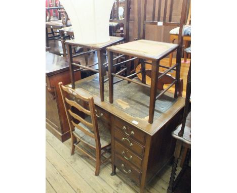An Edwardian mahogany five drawer lady's writing desk with brown leather inset, a standard lamp, two dining chairs and one ot