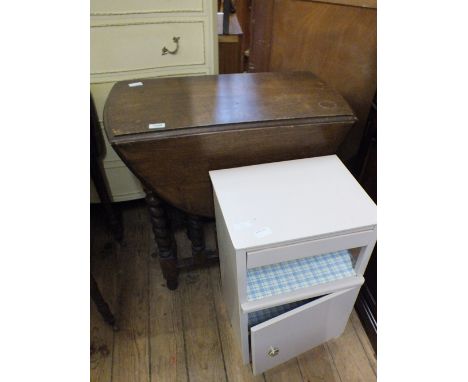 An oak gate leg table on barely twist supports and a painted bedside cabinet