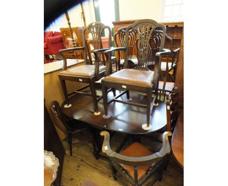 A pair of Chippendale style chairs, an oak gate leg table and four other dining chairs