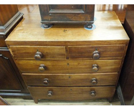 A mahogany and cross banded chest of two short and three long drawers on bracket feet