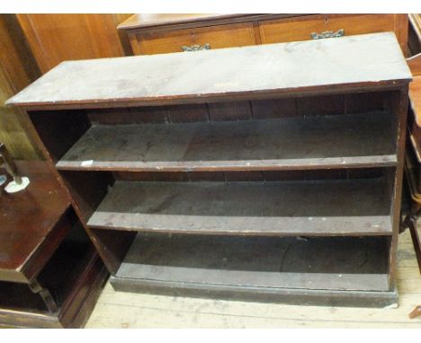 A three shelf stained pine floor standing bookcase