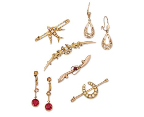 A group of jewellery, comprising: three gold half pearl set brooches, one of crescent design, the other of horseshoe design, 