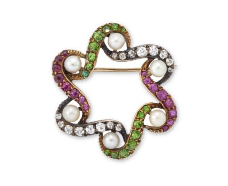 An Edwardian demantoid garnet, diamond and ruby brooch, of openwork garland design with S shaped lines of alternately set dem