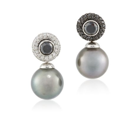 A pair of diamond, black diamond and South Sea cultured pearl asymmetric 'night and day' earrings,&nbsp;each earring designed
