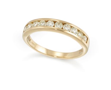 An 18ct gold diamond half hoop ring,&nbsp;a row of channel set brilliant cut diamonds to plain hoop, Birmingham, ring size R&