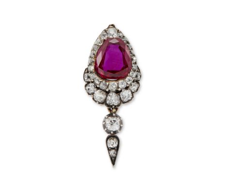 An early 19th century ruby and diamond drop, the pear cut ruby with a weight of 1.38 carats, within old cut diamond surround,