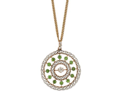 An early 20th century gold and platinum, diamond and demantoid garnet pendant,&nbsp;the central old cut diamond to openwork s