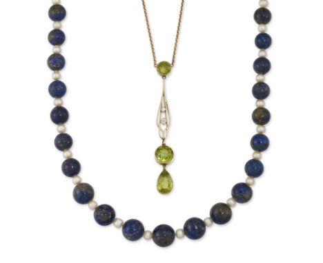 An early 20th century 15ct gold peridot and diamond pendant,&nbsp;the pendant of drop form suspending pear and round cut peri