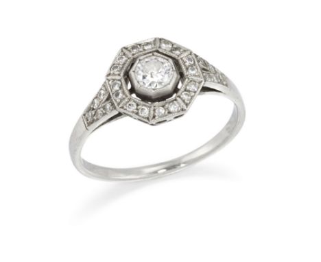An early 20th century diamond cluster ring,&nbsp;the central millegrain set brilliant cut diamond within openwork octagonal b