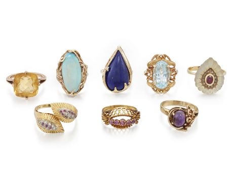 A group of eight rings, comprising: a single stone aquamarine ring, stamped 585, ring size O; an 18ct gold ruby and diamond c