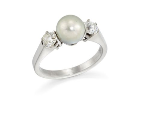 A diamond and cultured pearl three stone ring, the central cultured pearl flanked by two claw set old mine cut diamonds, ring