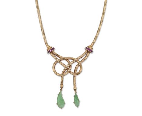 A 9ct gold ruby and jade necklace, the knotted centrepiece suspending two graduated carved jade drops, mounted in platinum an