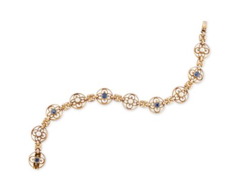 An Edwardian 15ct gold sapphire and half pearl bracelet, with a series of openwork circular links with quatrefoil wirework, a
