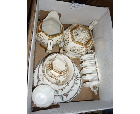 A Britannia pottery Art Deco white and gold Teapot and stand, milk and water jug, a gilt and white cup and saucer, toast rack