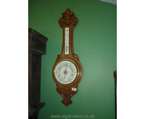 An early 20th c. carved Oak framed Aneroid Barometer/Thermometer, 35 1/2'' overall