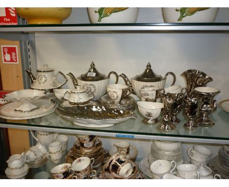 A large quantity of Royal Winton silver 25th Wedding Anniversary teasets including three teapots, two bread/butter plates, a 