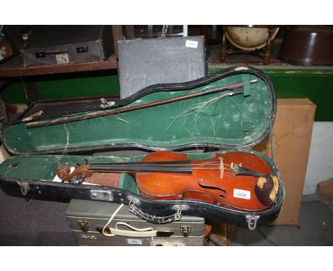 A vintage Violin in case with bow, spare strings, etc.