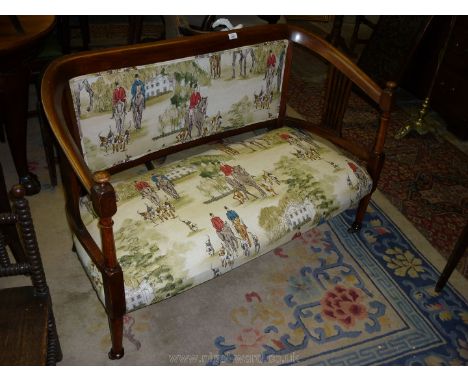 An Edwardian satinwood show framed two seater Sofa, having pierced splats to either end, standing on turned legs and upholste