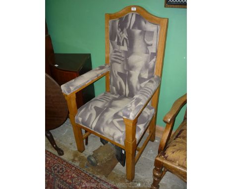 An imposing light Oak framed Elbow Chair having seat, backrest and arm pads, upholstered in sepia coloured Andrew Martin fabr