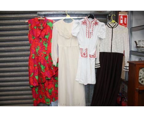 Four vintage dresses.