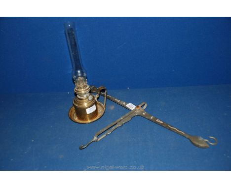 A brass weighing scales balance bar.