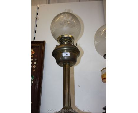 A Brass coloured Oil lamp with a white etched globe and chimney.