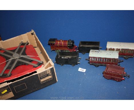 A Hornby Gauge O clockwork Train set with LMS engine and tender, coaches, wagons and track (1950's).