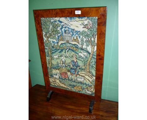 A large Fire screen with embroidered scene of shepherd, his wife and their sheep