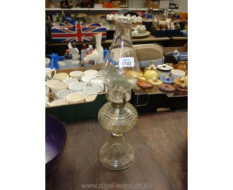 A clear glass Oil lamp.