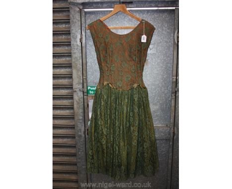 A vintage green lace Dress with brown and green underlining and paper petticoat, size 36.