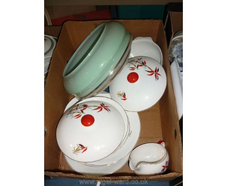 A part dinner service with dinner plates, vegetable dishes, gravy boat, in white with red and black bamboo shoots, together w