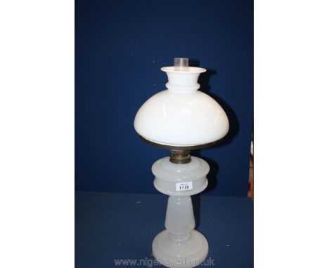 A white glass Lamp with shade and funnel.