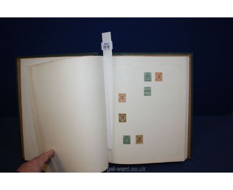 A green Eclipse stamp album : British Empire and Commonwealth mix ED VII and G V. Thin minor picking but a lot of useful mate