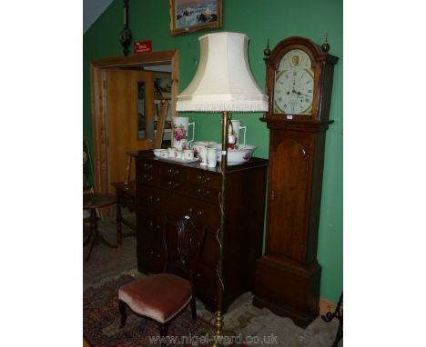 A heavy Brass Standard Lamp having a fringed cream fabric octagonal shade, 77 1/2'' tall overall