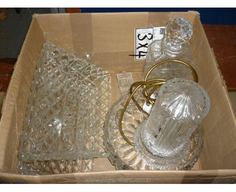 A glass trifle bowl, a decanter with stopper, a glass dressing table tray and a lamp.