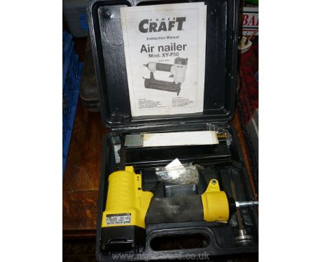A "Power Craft" Air Nailer Model "XY-F50" with instruction leaflet and a small quantity of brads.
