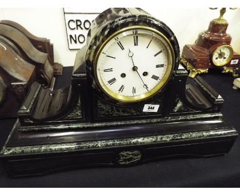 A good French black and green marble cased mantel clock of impressive proportions, the architectural case with drum form top 