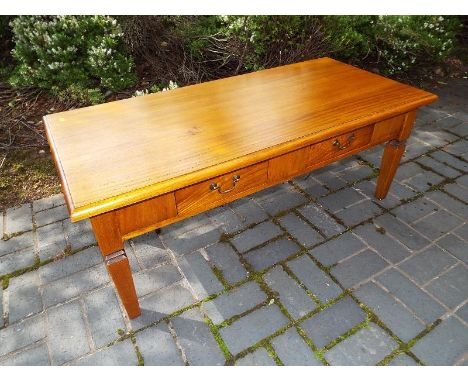 A good quality light oak rectangular coffee table with twin drawers and drop handles 49cm x 127cm x 60cm