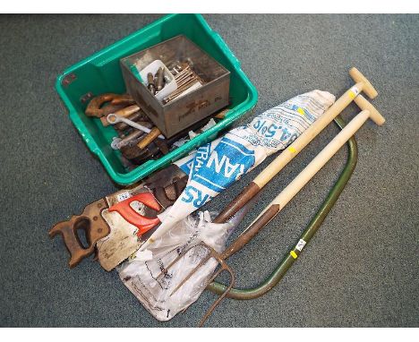 A mixed lot of garden and hand tools to include saws, hammers, spanners, spade, fork and similar (qty)