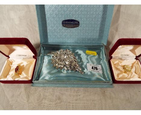 A good quality lady's vintage brooch in the form of a bouquet, and two Camelot plated brooches boxed (3)