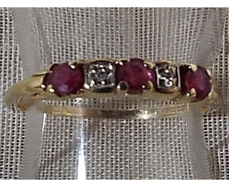 A lady's 9ct gold ruby and diamond eternity ring, size M 1/2, approximate weight 1.21 grams