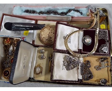 A good collection of vintage costume jewellery to include a silver belcher chain with hallmarked silver locket, a silver broo