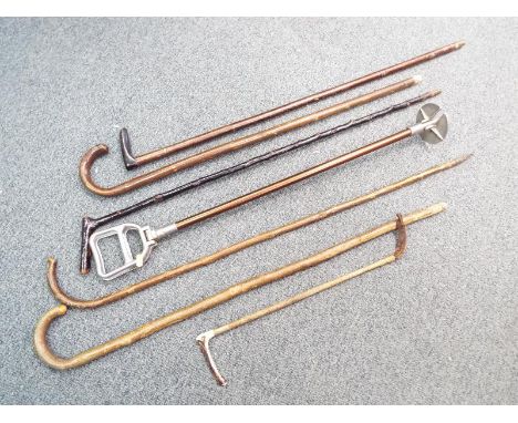 Approx six walking sticks, shooting stick, riding crop