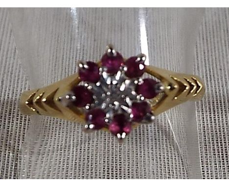 A lady's 18ct gold ring with ruby and diamond cluster, size P, approximate weight 3.45 grams  Est £80 - £120