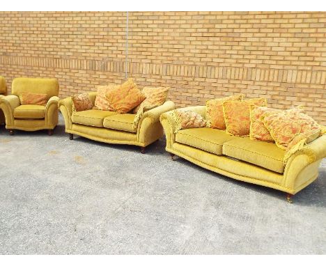 A good quality three seater sofa and a single armchair, gold coloured upholstery - included in the lot are a selection of sca