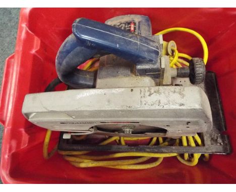 A Robi industrial rotary saw with cable