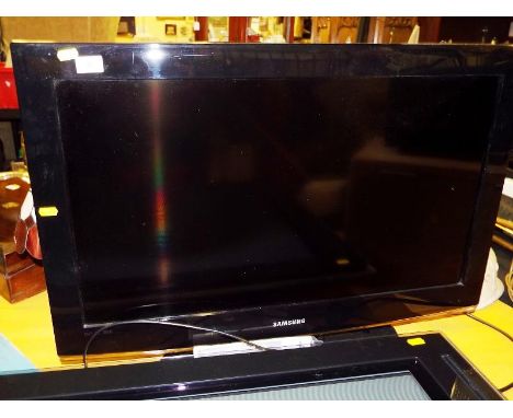 A Samsung LCD HD television, 32 inch, Model No LE32A456C2D, with remote and manual