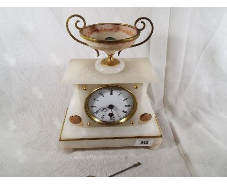 An attractive alabaster cased French timepiece mantel clock, white enamel dial with Roman numerals, the case accented with br