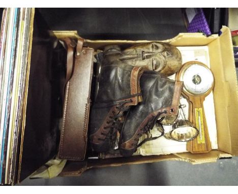 A mixed lot to include vintage ice skates, 33.3 rpm vinyl records, barometer and similar